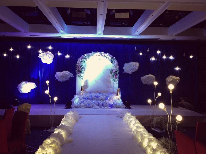 Wedding stage hire backdrop design decorated with red roses